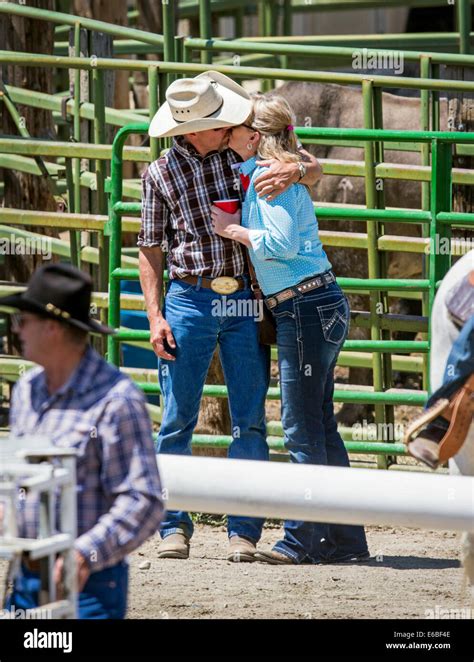 cowgirls kissing|Cowboy and Cowgirl Kissing at the Rodeo .